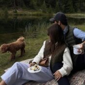 Happy couple with dog enjoying nature, matched by professional matchmaker Match Maison.