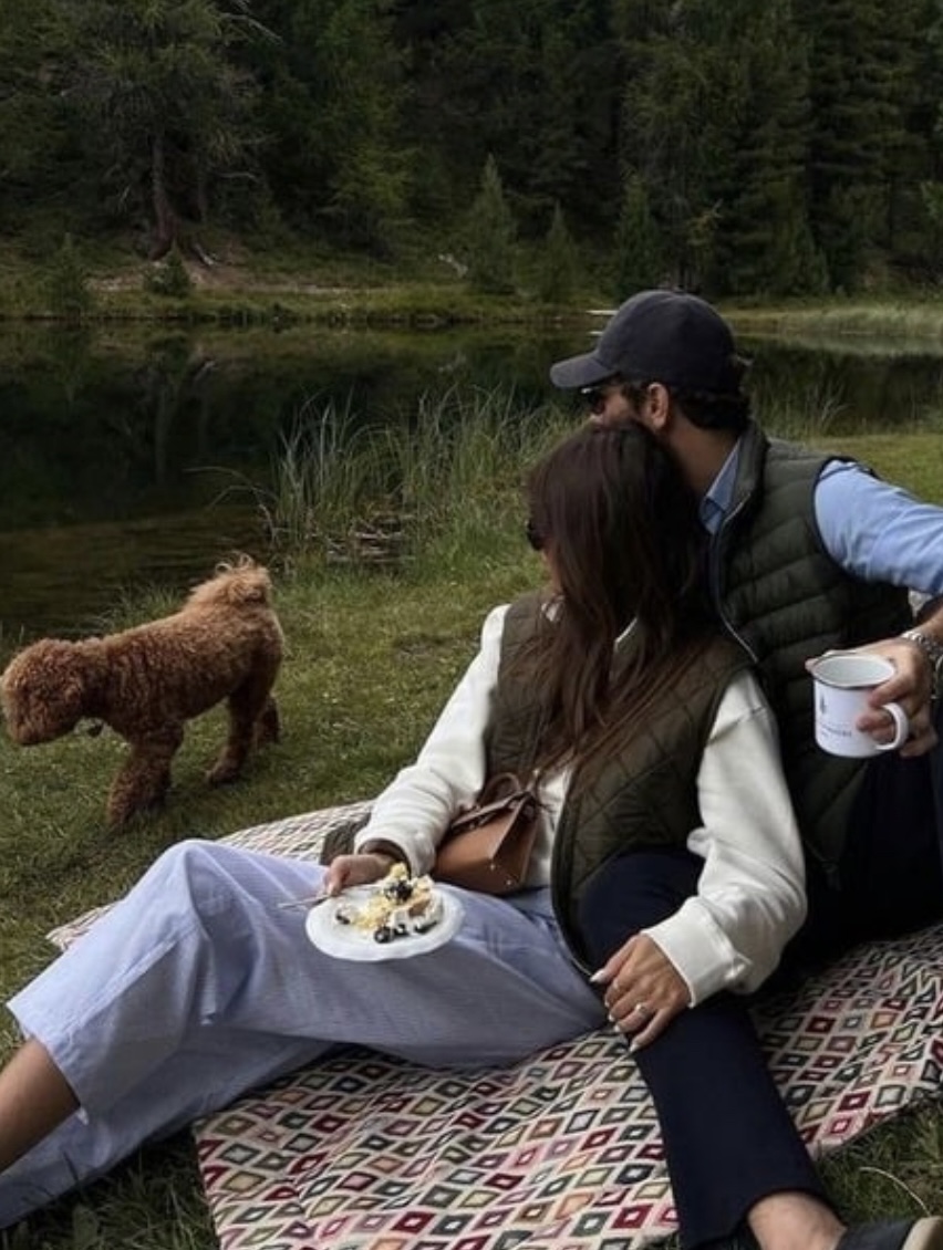 Happy couple with dog enjoying nature, matched by professional matchmaker Match Maison.